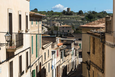 High angle view of buildings in town against sky