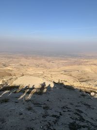 Scenic view of land against sky during winter