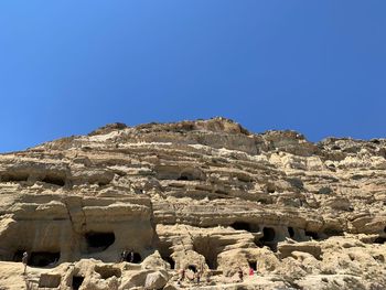 Scenic view of rocky mountains against clear blue sky