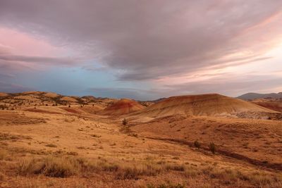 Scenic view of arid landscape against sky