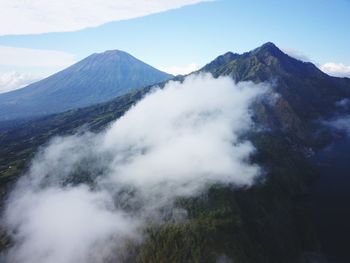 Scenic view of volcanic mountain range against sky