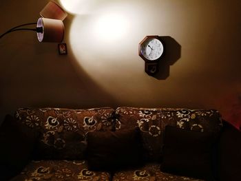 Close-up of illuminated clock at home