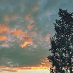 Low angle view of cloudy sky at sunset