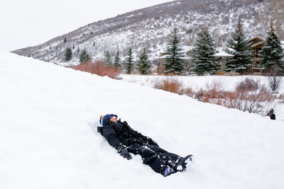 Man skiing on snow covered field