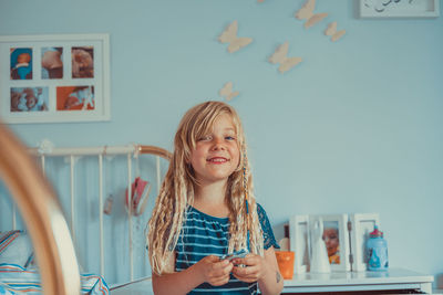 Portrait of smiling girl at home