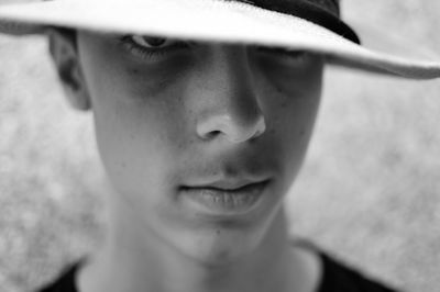 Close-up of teenage boy wearing hat