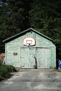 View of road sign by building