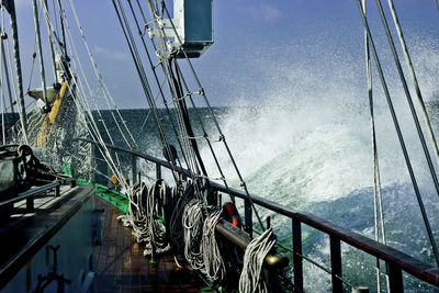 Ship sailing on sea against sky