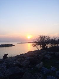 Scenic view of sea against sky at sunset