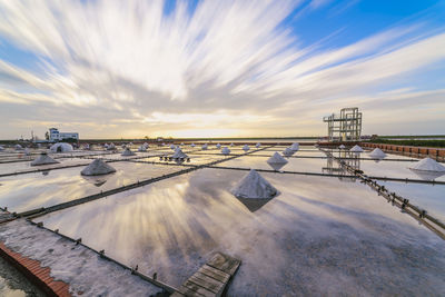 Factory against sky during winter