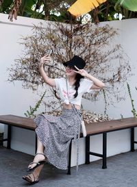 Portrait of woman sitting on chair