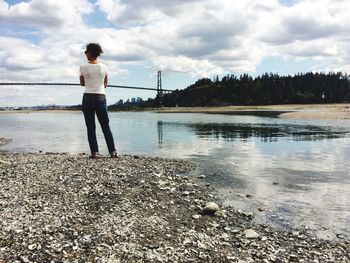 Woman looking at the ocean at low tide