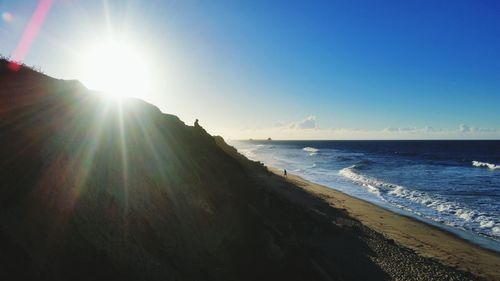 Sun shining over sea