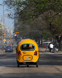 Yellow car on city street