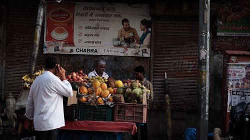 Group of people at market stall