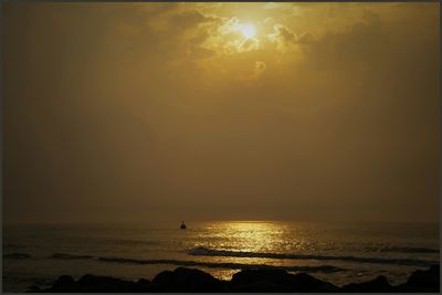 Scenic view of sea at sunset