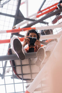 Portrait of young woman using phone