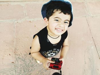 Portrait of happy boy playing