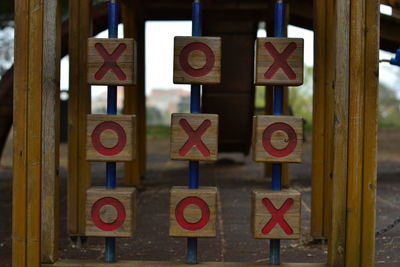 Close-up of information sign on wood