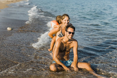 Smiling family enjoying at beach