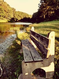 Scenic view of river with trees in background