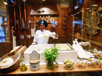 Full length of man standing in store