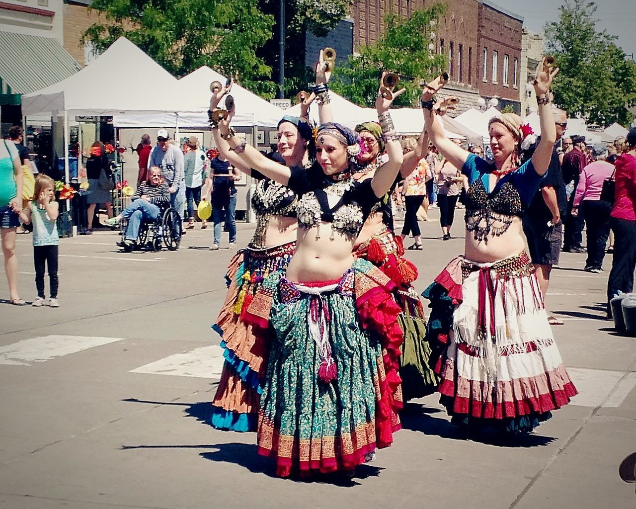 large group of people, real people, built structure, celebration, building exterior, dancing, day, performance, architecture, outdoors, lifestyles, women, musician, crowd, city, people