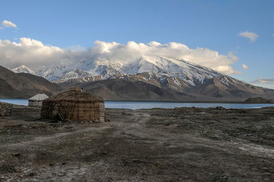 Scenic view of snowcapped mountains against sky