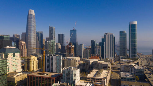 Modern buildings in city against sky