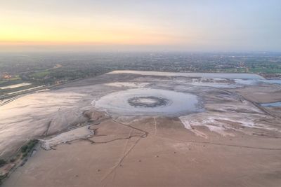 Aerial view of city during sunset