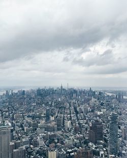 Aerial view of cityscape against sky