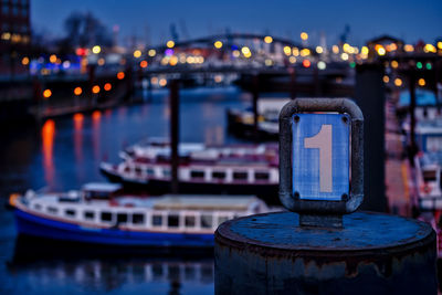 Close-up of illuminated boat in river at night