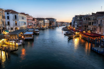 Canal amidst buildings in city