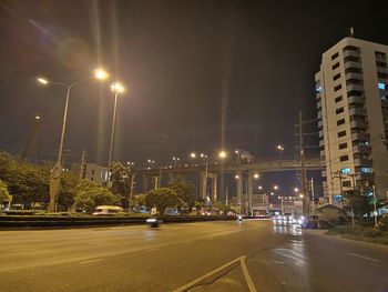 Cars on illuminated road at night