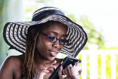 Close-up of woman using smart phone