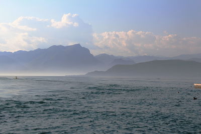 Scenic view of sea against cloudy sky