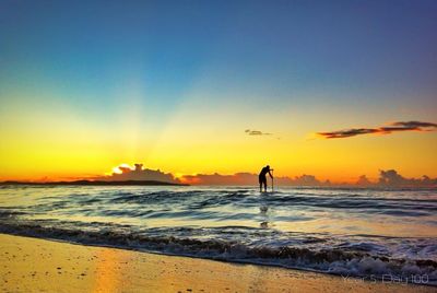 Scenic view of sea at sunset