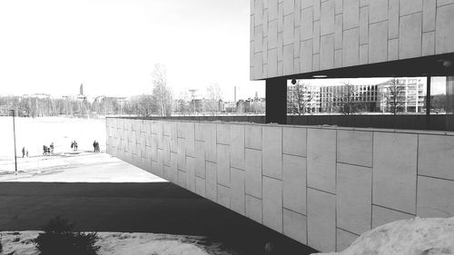 Footpath by building against sky