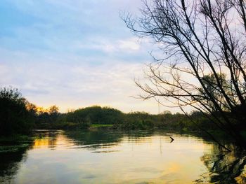 Scenic view of lake against sky during sunset