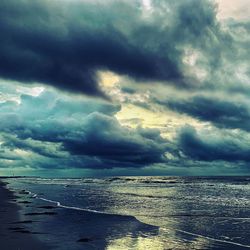 Scenic view of sea against dramatic sky