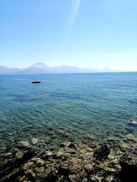 Scenic view of sea against clear blue sky