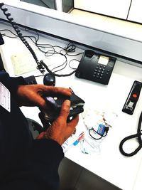 High angle view of man working on table