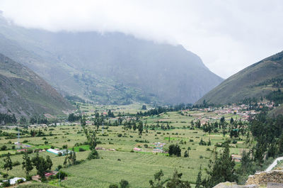 Panoramic view of landscape and buildings against mountains