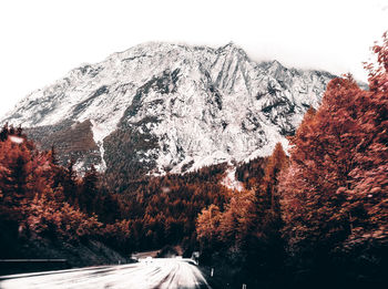 Scenic view of snowcapped mountains against sky during winter