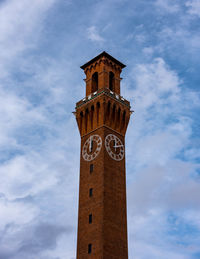 Low angle view of clock tower against sky