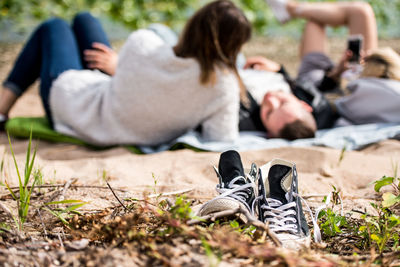 Low section of women relaxing on grass