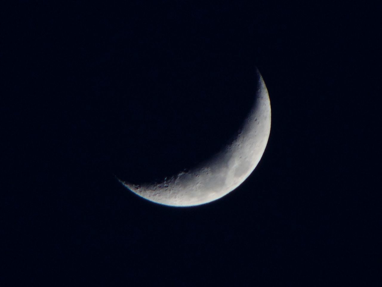 LOW ANGLE VIEW OF HALF MOON AGAINST SKY AT NIGHT