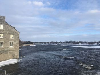 Scenic view of sea against sky during winter