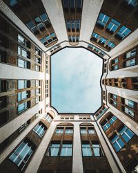 Low angle view of office building against sky