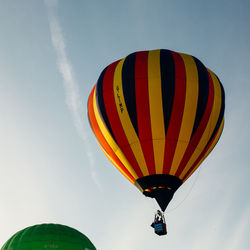 Low angle view of hot air balloon flying in sky